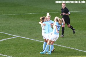 Izzy Christiansen (centre) celebrates her second penalty for Manchester City Women with Georgia Stanway (left) and Claire Emslie (right)