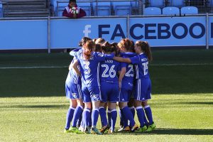 Lucy Quinn is mobbed by her Birmingham City Ladies team mates after scoring an early goal against Man City Women