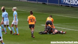 Remi Allen is buried by team mates after scoring the opening goal for Reading Women