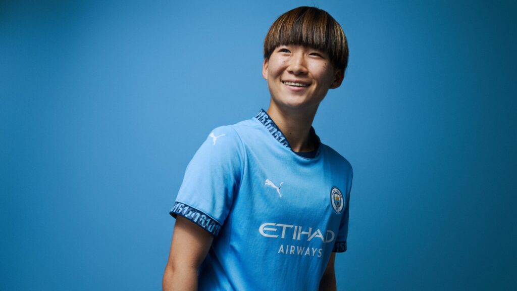 Aoba Fujino in the 2024-25 Manchester City home shirt