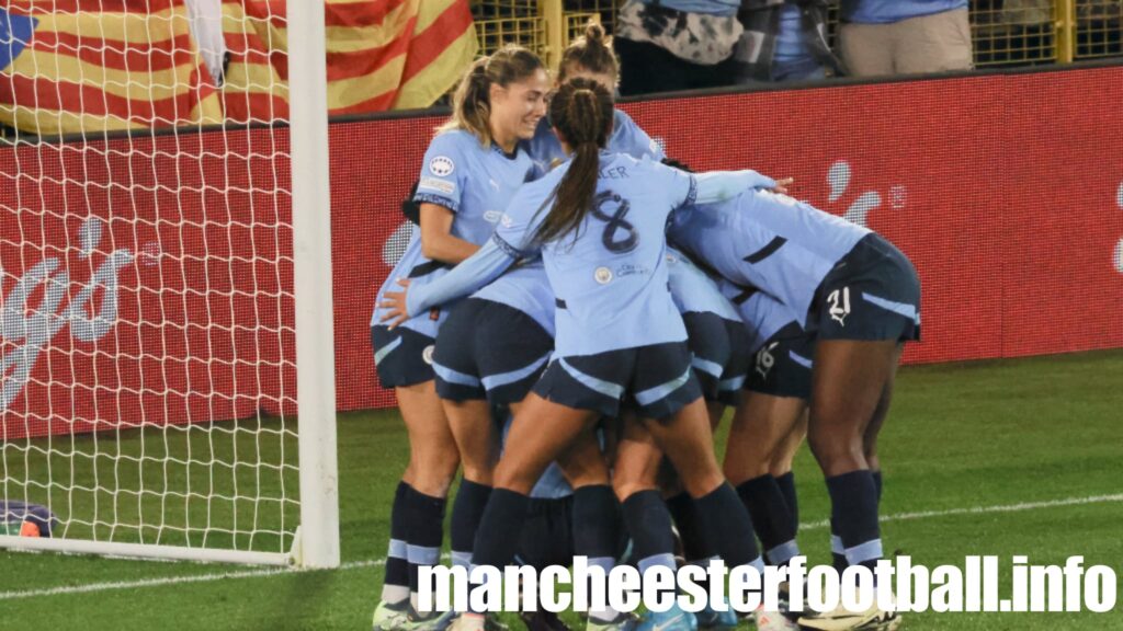 Naomi Layzell celebrates her first ever club goal - for Manchester City Women - under a pile of her team mates in the Champions League game against FC Barcelona - Wednesday October 9 2024